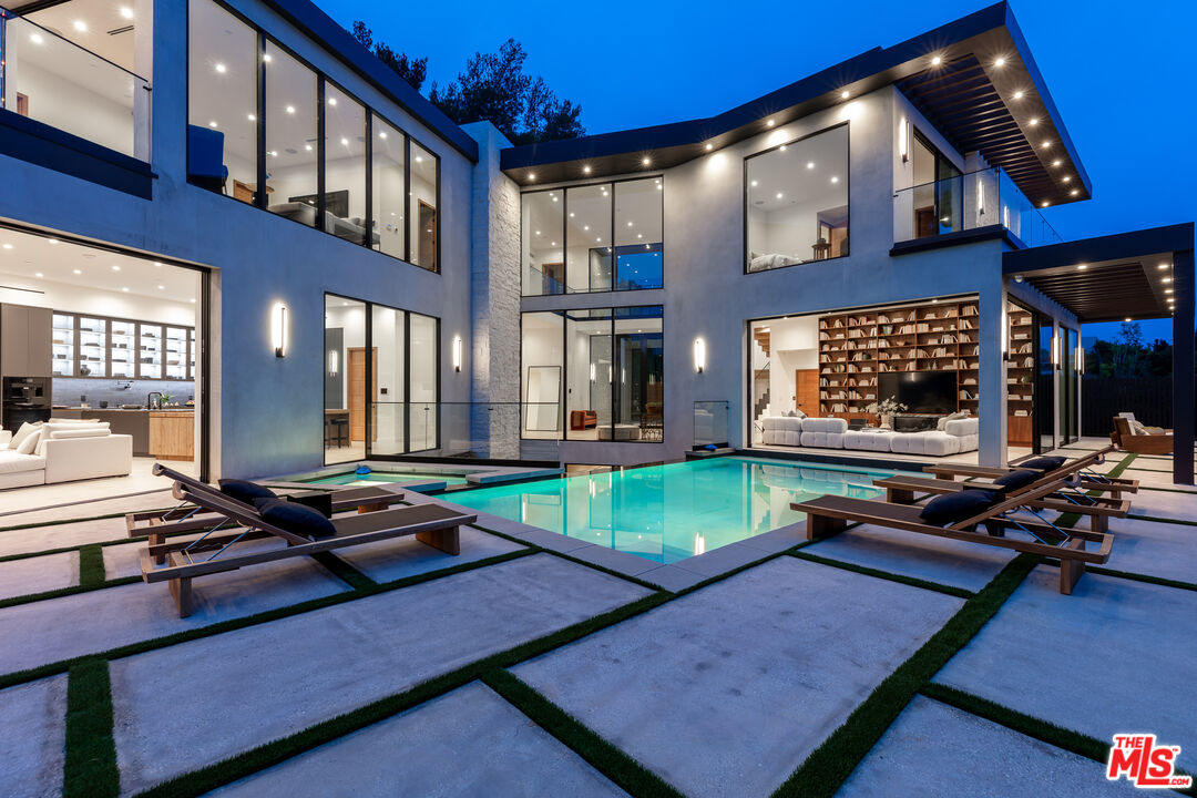 1523 Stradella Road Los Angeles, CA 90077 - Photo 8 of 54 a living room with furniture pool table and a large window