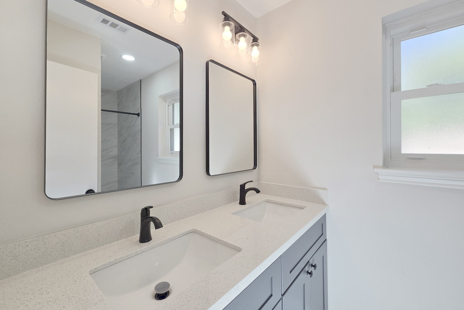8822 Rowan Lane Houston, TX 77036 - Photo 11 of 12 a bathroom with a sink and a mirror