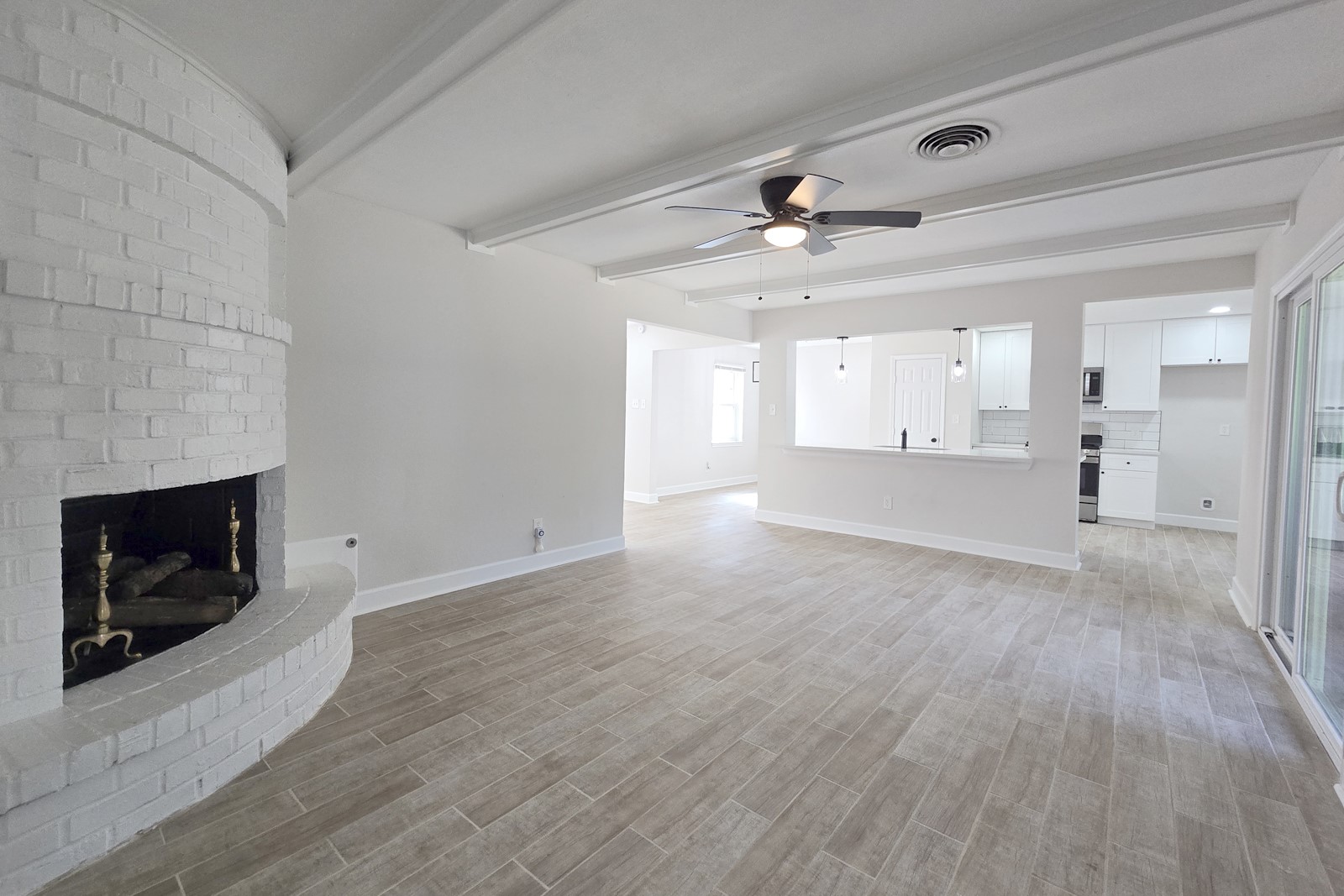 8822 Rowan Lane Houston, TX 77036 - Photo 4 of 12 a view of an empty room and fire place
