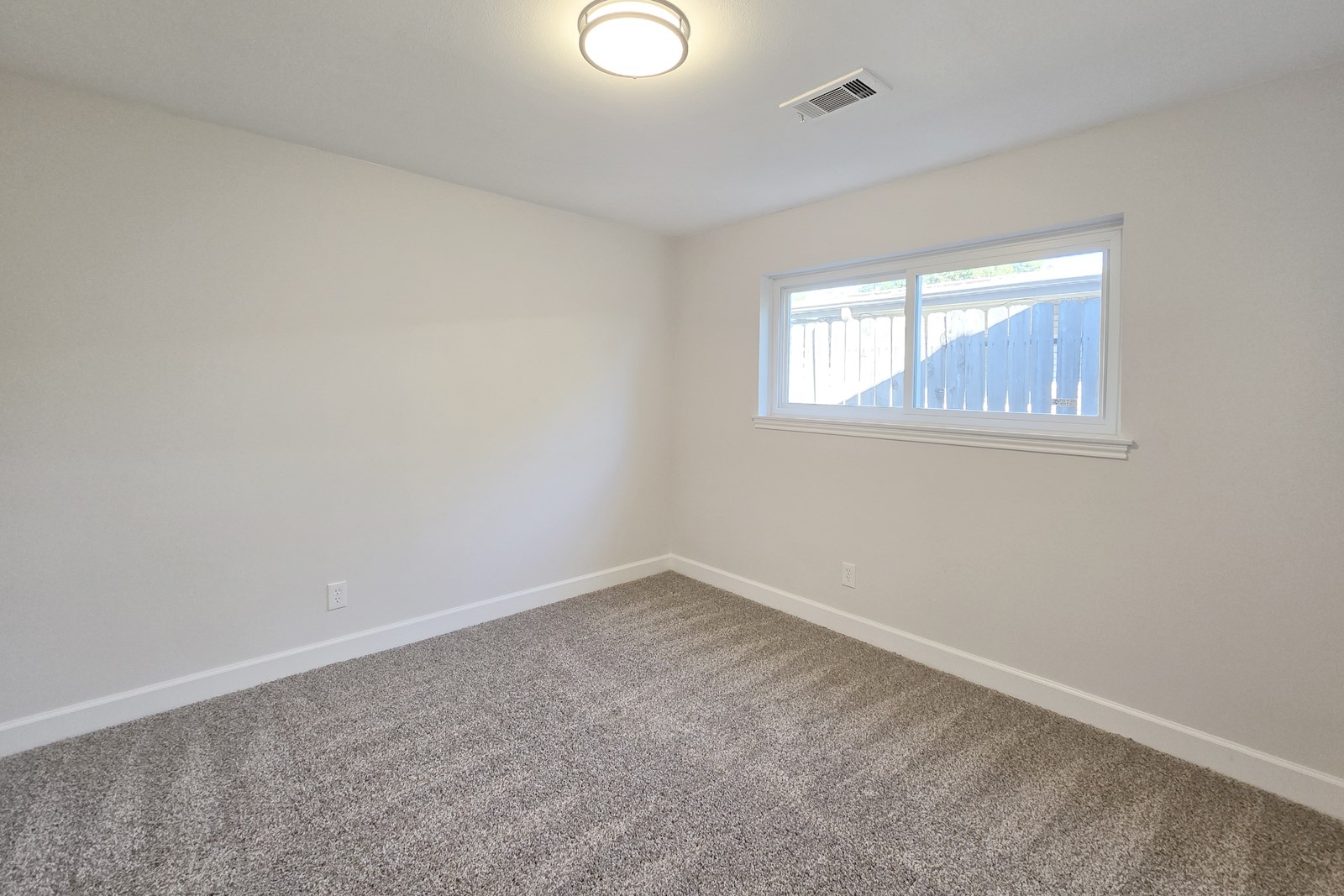 8822 Rowan Lane Houston, TX 77036 - Photo 8 of 12 an empty room with a window