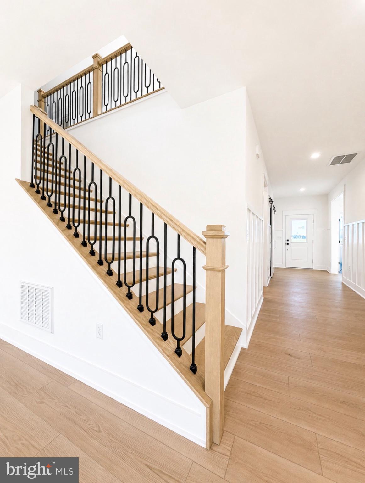 21963 Hardscrabble Road Georgetown, DE 19947 - Photo 30 of 43 Elegant staircase with modern flair.