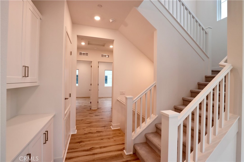 110 Yugen Irvine, CA 92618 - Photo 13 of 28 a view of an entryway with wooden floor and staircase