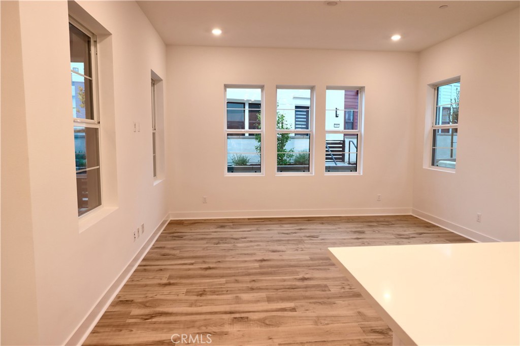 110 Yugen Irvine, CA 92618 - Photo 28 of 28 a view of an empty room with wooden floor and a window