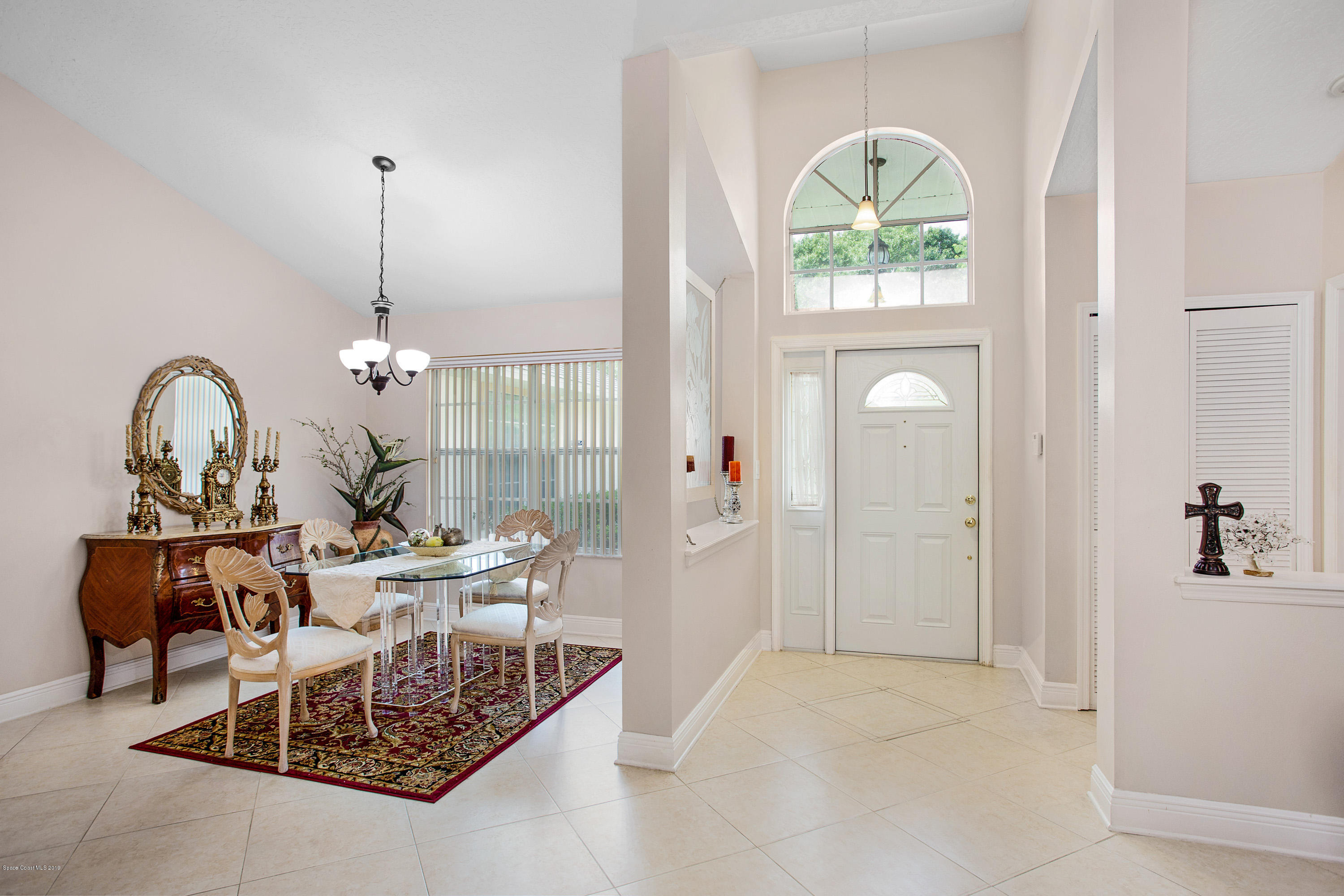 3445 Holly Springs Road Melbourne, FL 32934 - Photo 9 of 28 a view of a livingroom with furniture and window