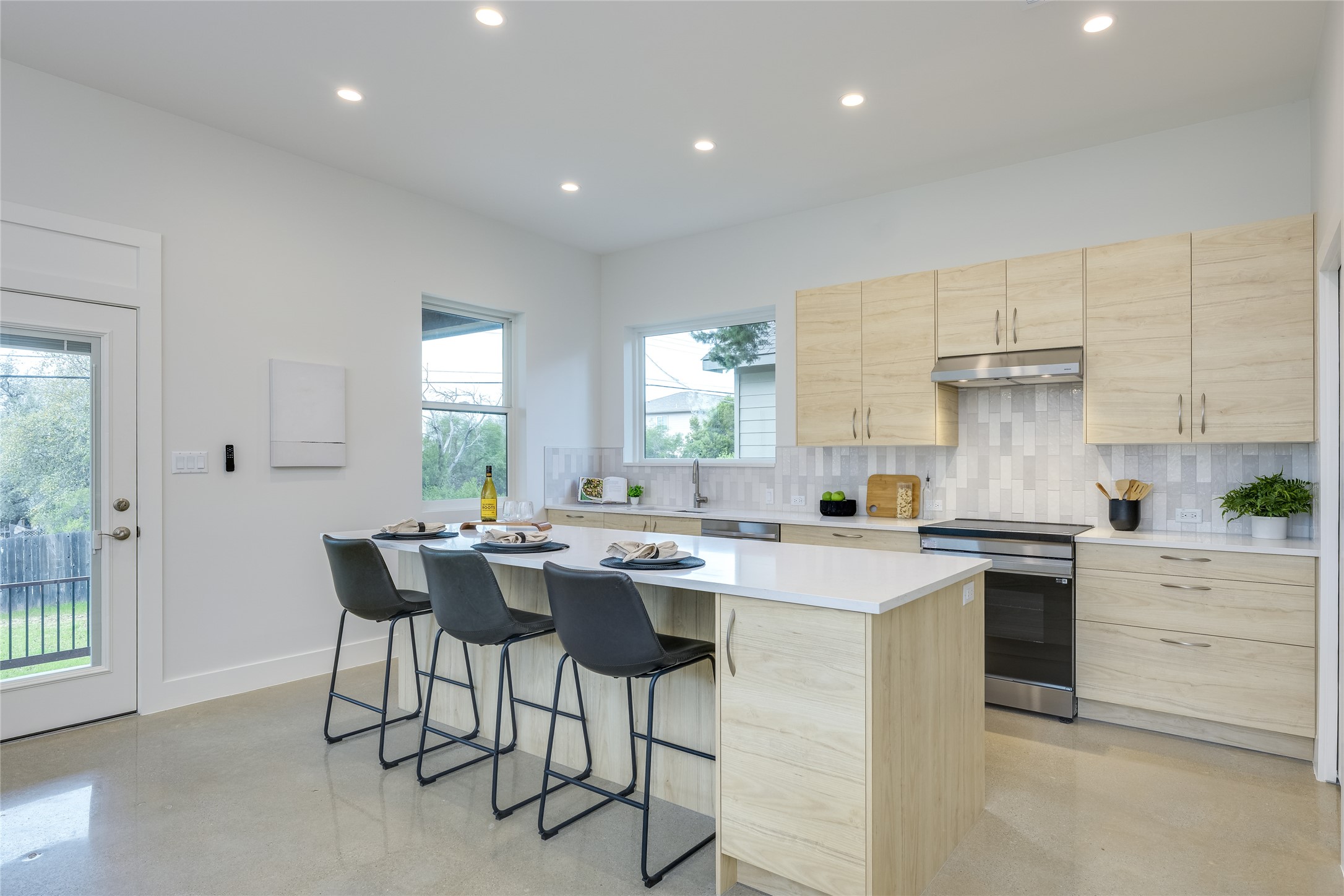 3014 Brass Buttons Trail Austin, TX 78734 - Photo 12 of 35 Kitchen has Carrera quartz countertops and stainless steel Energy Star appliances.