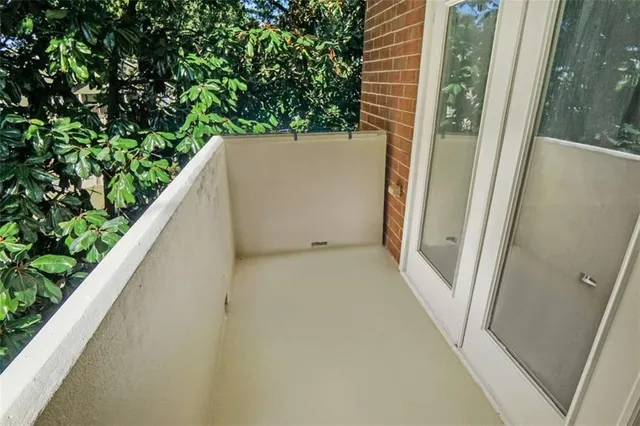 a room with gym equipment and a view of living room