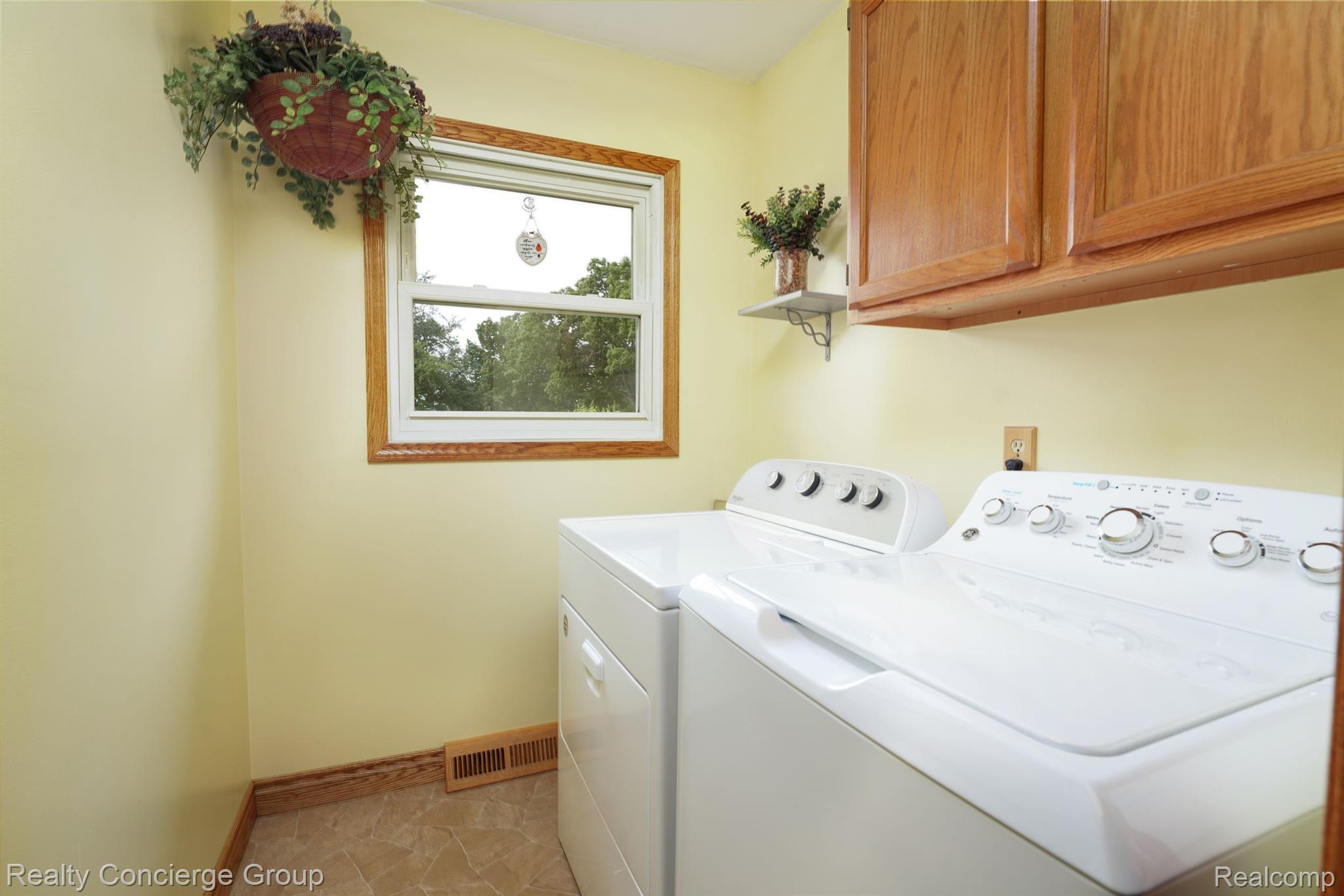 3018 Moyer Road Williamston, MI 48895 - Photo 14 of 28 First floor laundry provides added storage space