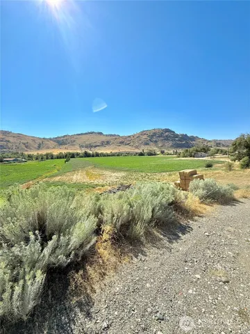 a view of an ocean and a mountain