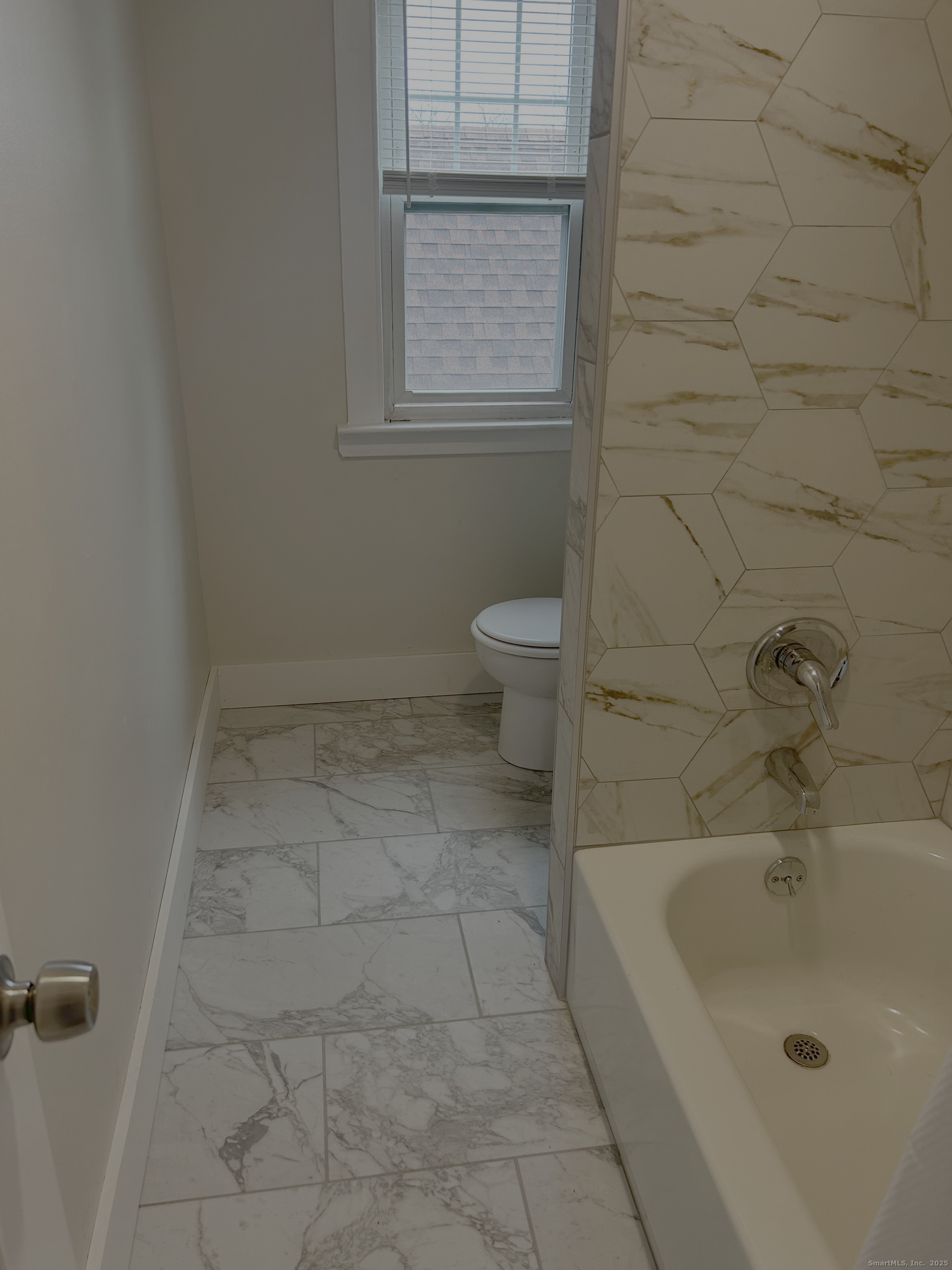64 Lexington Street Hamden, CT 06514 - Photo 6 of 6 a bathroom with a sink a toilet and window