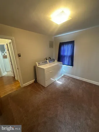 a room with a bed and a window