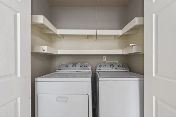 a utility room with dryer and washer