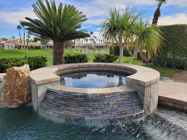 a view of a yard with a fountain