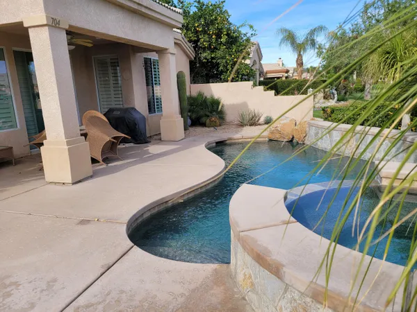 a view of outdoor kitchen outdoor dining space and seating area