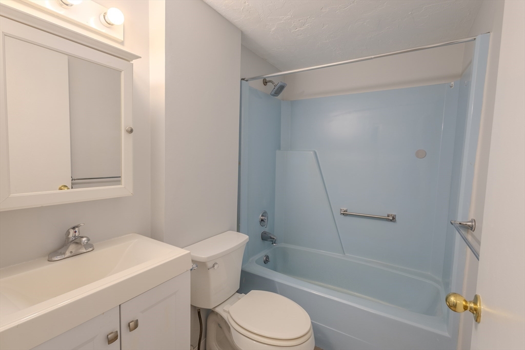 5 Tideview Path, Unit 4 Plymouth, MA 02360 - Photo 5 of 16 a bathroom with a sink toilet and shower