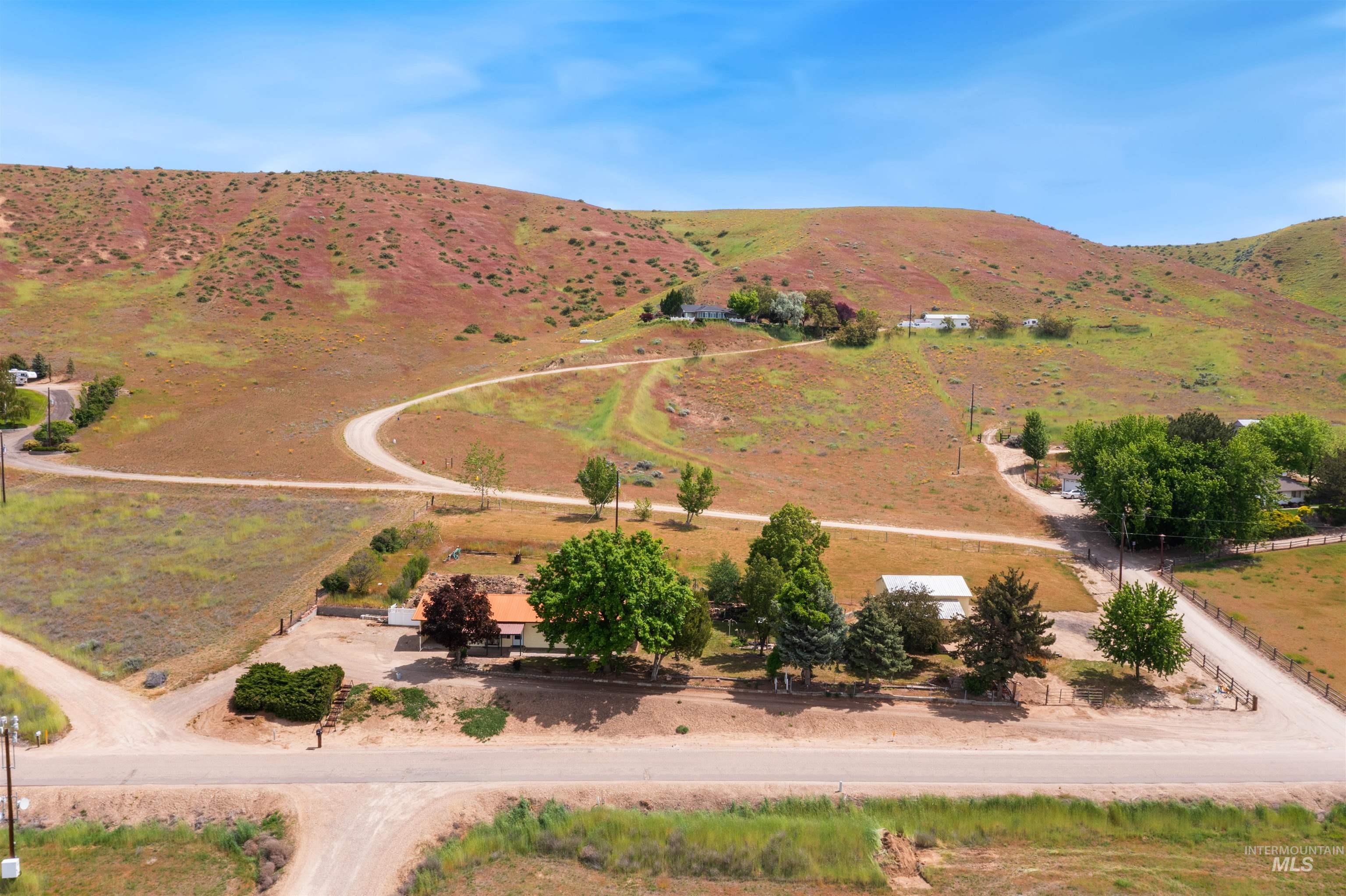 12184 Hill Road Payette, ID 83661 - Photo 5 of 35 Expansive property featuring rolling hills and multiple structures