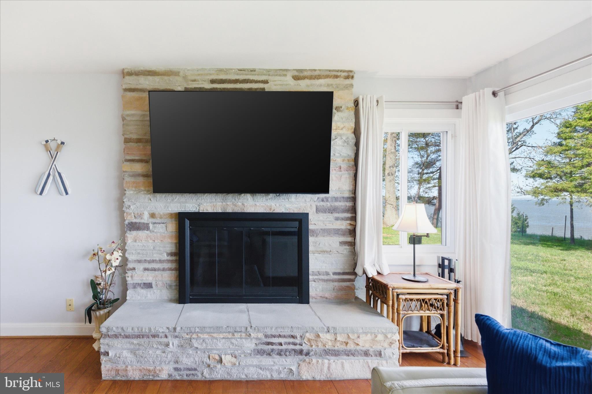 43732 Raspberry Lane Hollywood, MD 20636 - Photo 13 of 54 a living room with furniture a fireplace and a flat screen tv