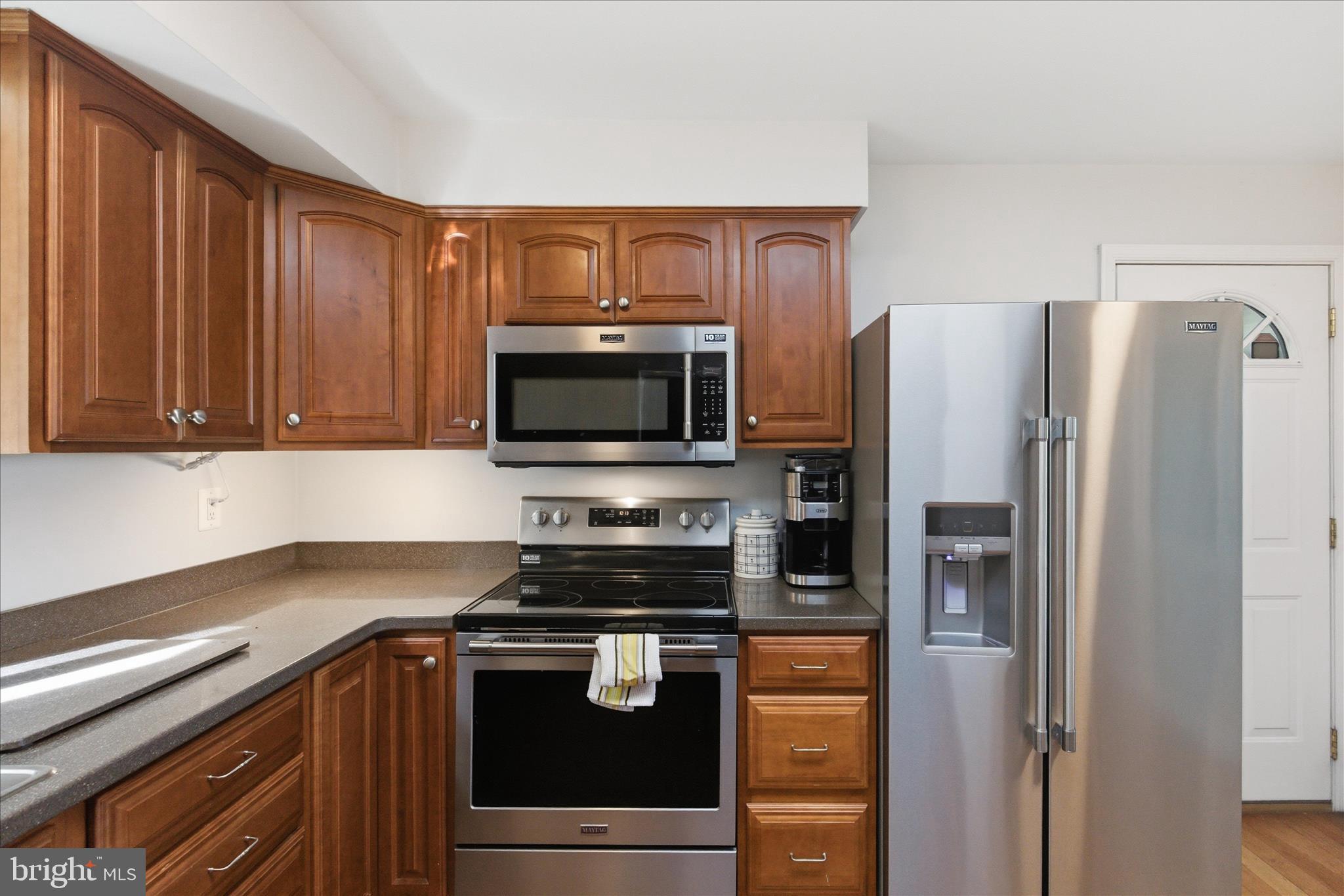 43732 Raspberry Lane Hollywood, MD 20636 - Photo 17 of 54 a kitchen with stainless steel appliances granite countertop a refrigerator stove and microwave