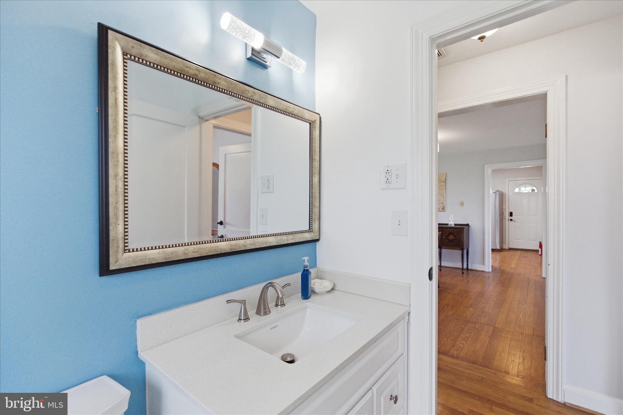 43732 Raspberry Lane Hollywood, MD 20636 - Photo 25 of 54 a bathroom with a sink vanity and mirror