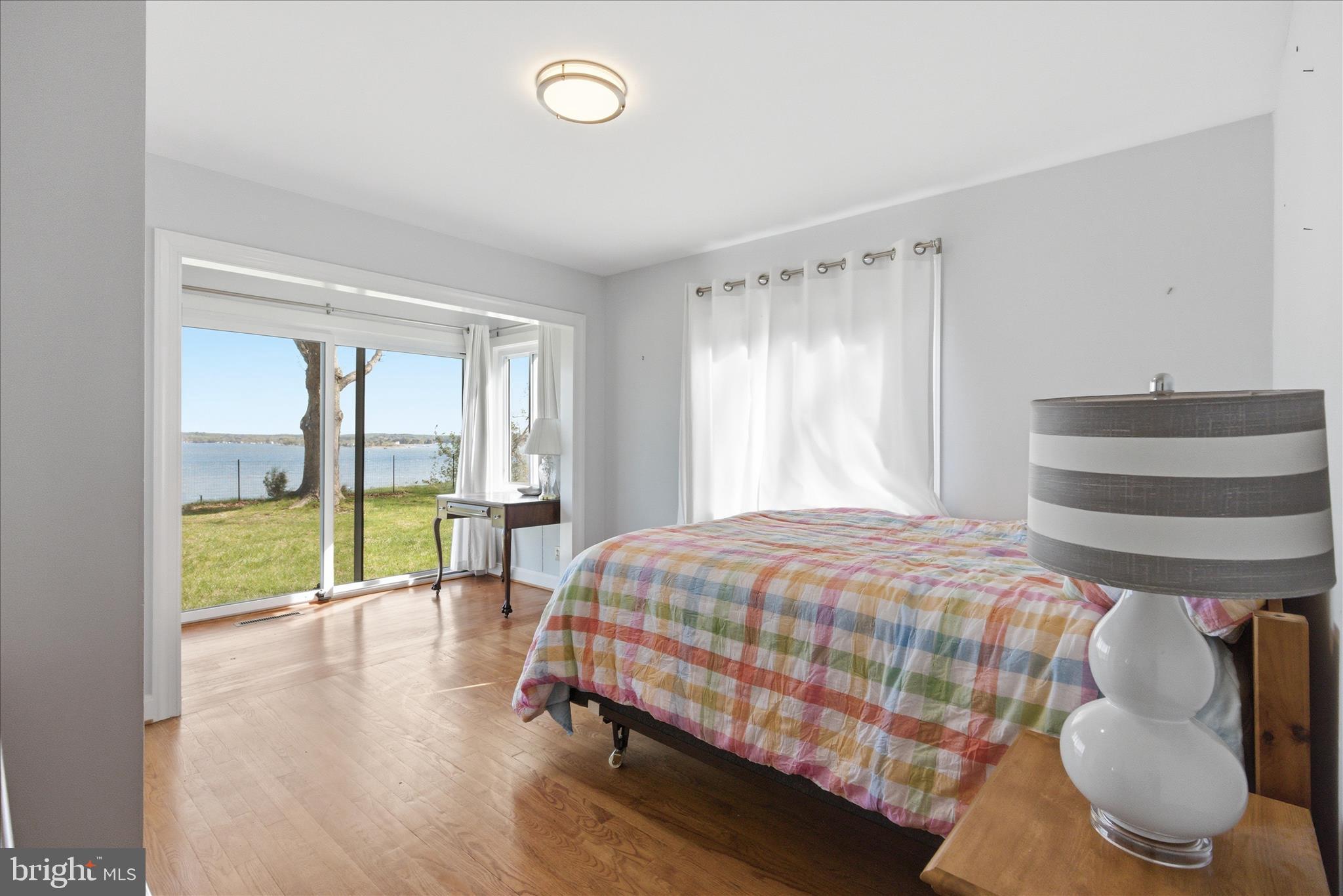 43732 Raspberry Lane Hollywood, MD 20636 - Photo 26 of 54 a bedroom with a bed and large window