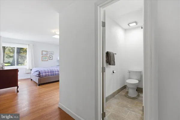 a bathroom with a granite countertop sink and mirror