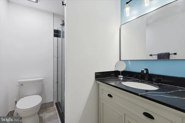 a kitchen with a refrigerator a stove a washer and dryer