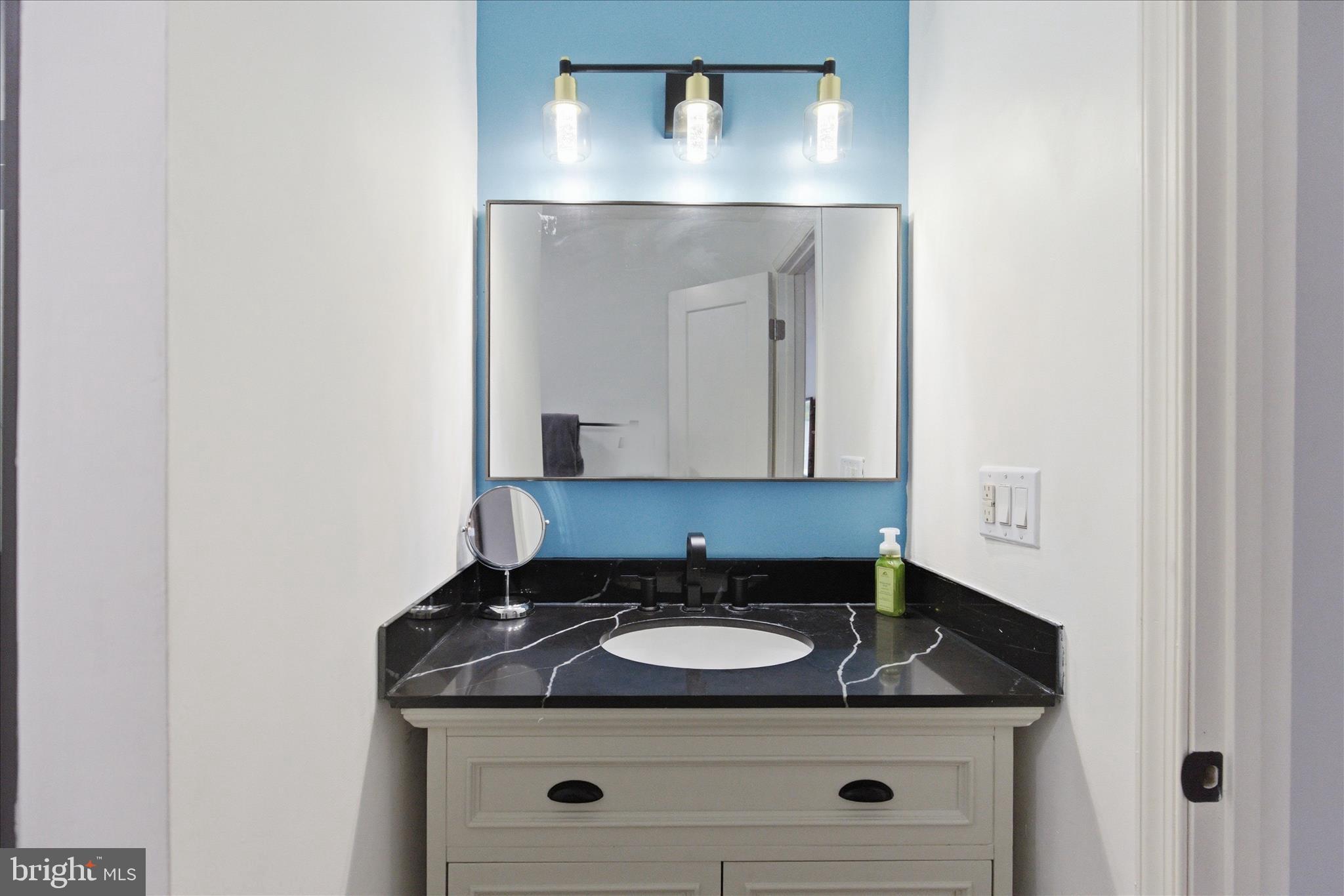 43732 Raspberry Lane Hollywood, MD 20636 - Photo 37 of 54 a bathroom with a granite countertop sink and mirror