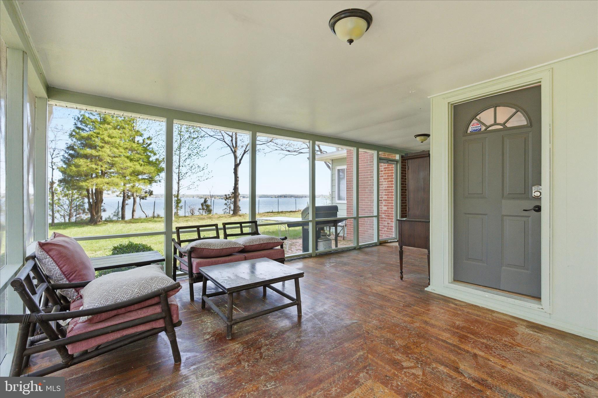 43732 Raspberry Lane Hollywood, MD 20636 - Photo 6 of 54 a living room with furniture and a floor to ceiling window