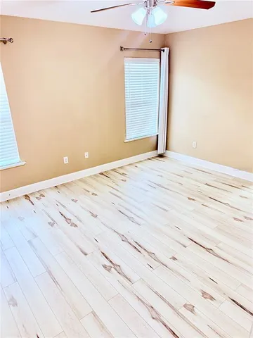 a view of wooden floor and cabinet in a room