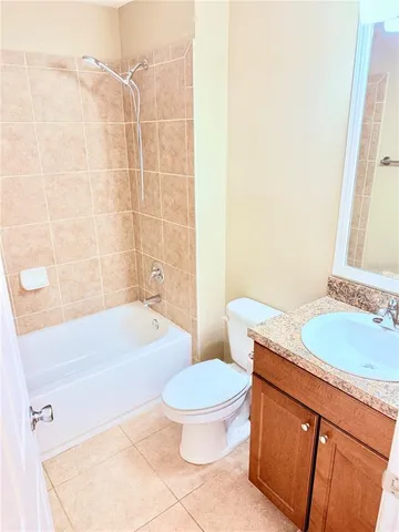 a bathroom with a sink a toilet and a bathtub