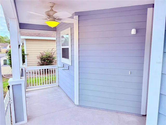 a view of a porch with wooden fence