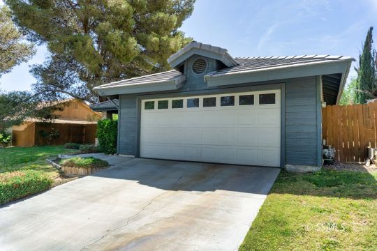 241 West Yellowstone Place Ridgecrest, CA 93555 - Photo 2 of 31 a front view of a house with a yard