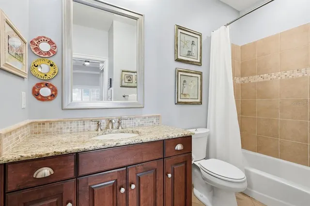 a view of a large building with a yard in front of it