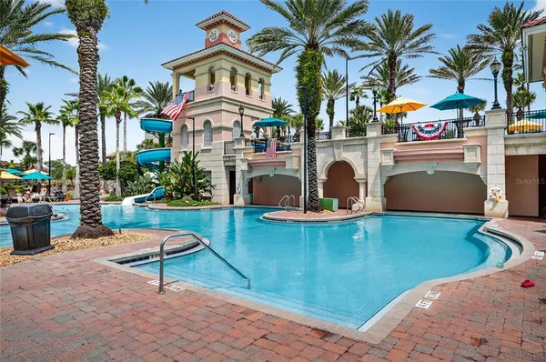 a view of a house with palm trees