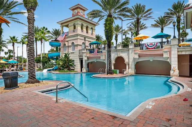 a view of a house with palm trees