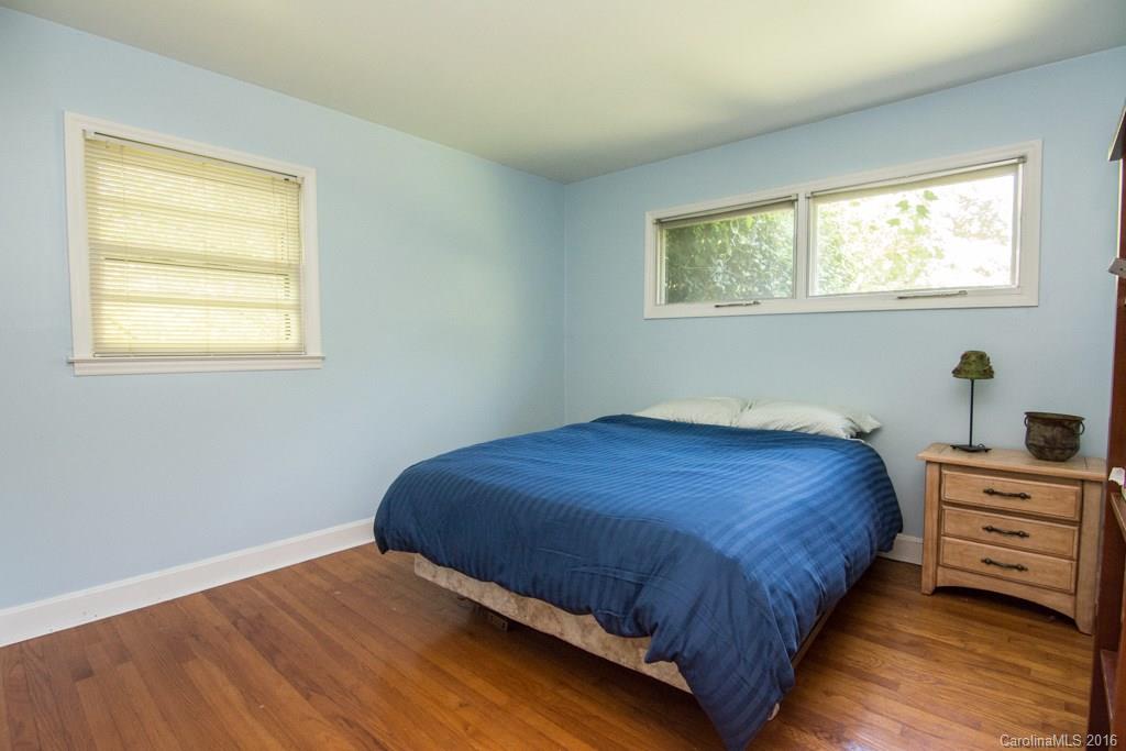 7424 Watercrest Road, Unit 14 Charlotte, NC 28210 - Photo 13 of 21 a bedroom with a bed and a window