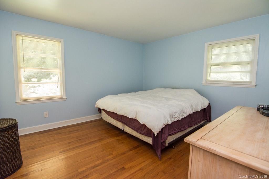 7424 Watercrest Road, Unit 14 Charlotte, NC 28210 - Photo 16 of 21 a bedroom with a bed and window