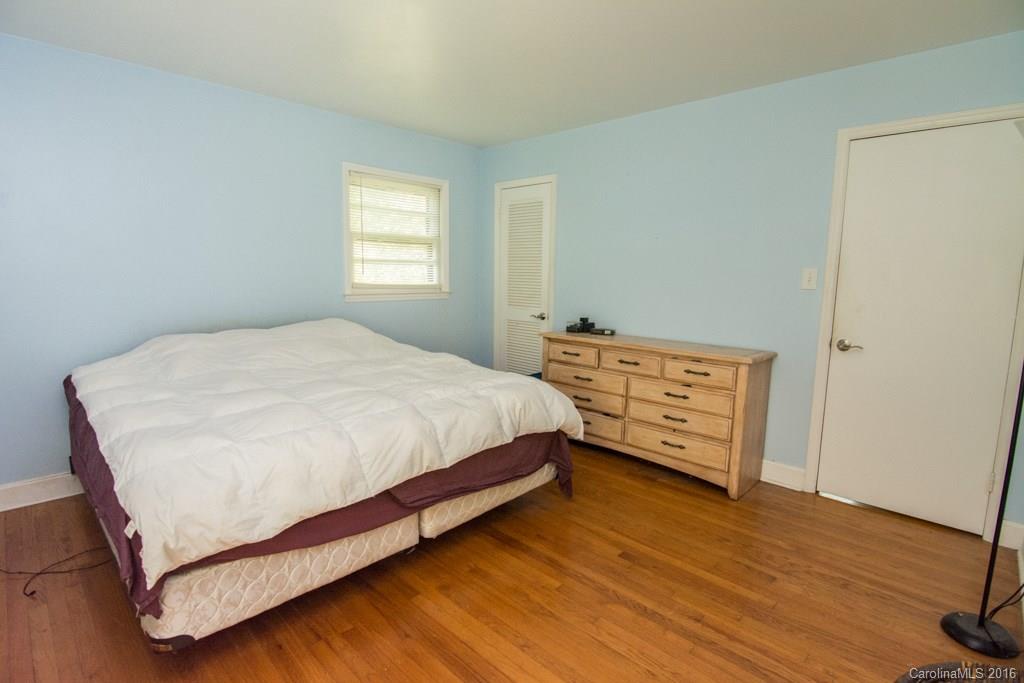 7424 Watercrest Road, Unit 14 Charlotte, NC 28210 - Photo 17 of 21 a bedroom with a bed a window and closet