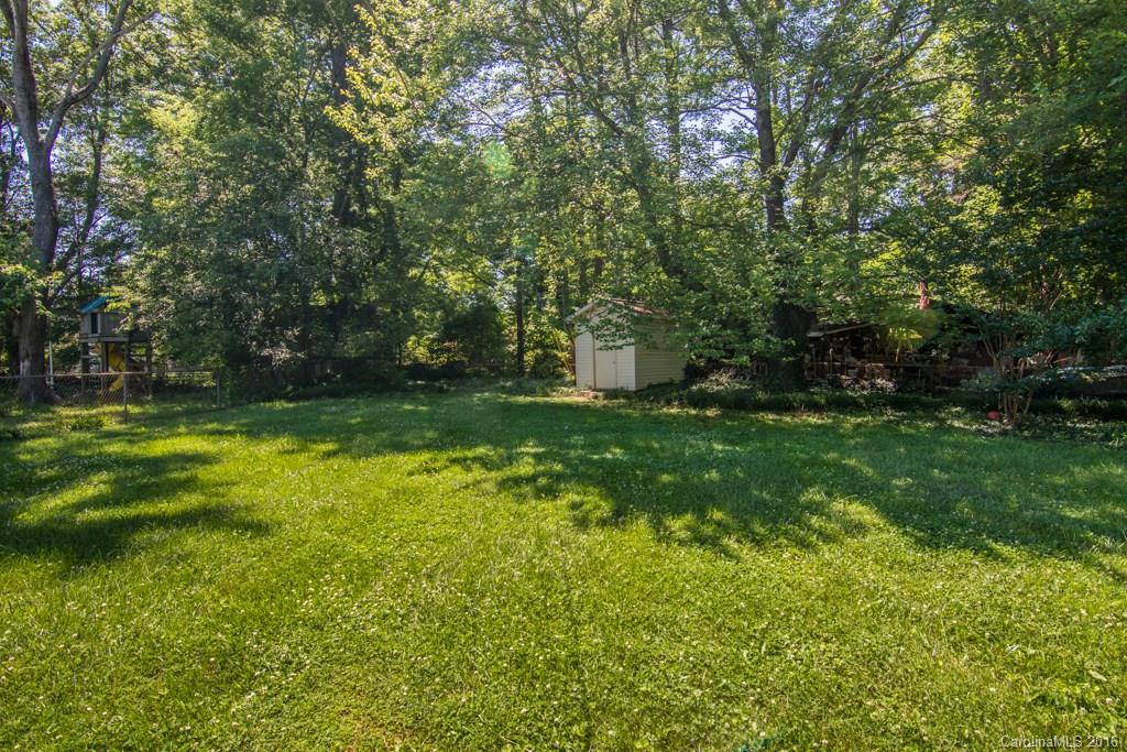 7424 Watercrest Road, Unit 14 Charlotte, NC 28210 - Photo 20 of 21 a view of a backyard with large trees