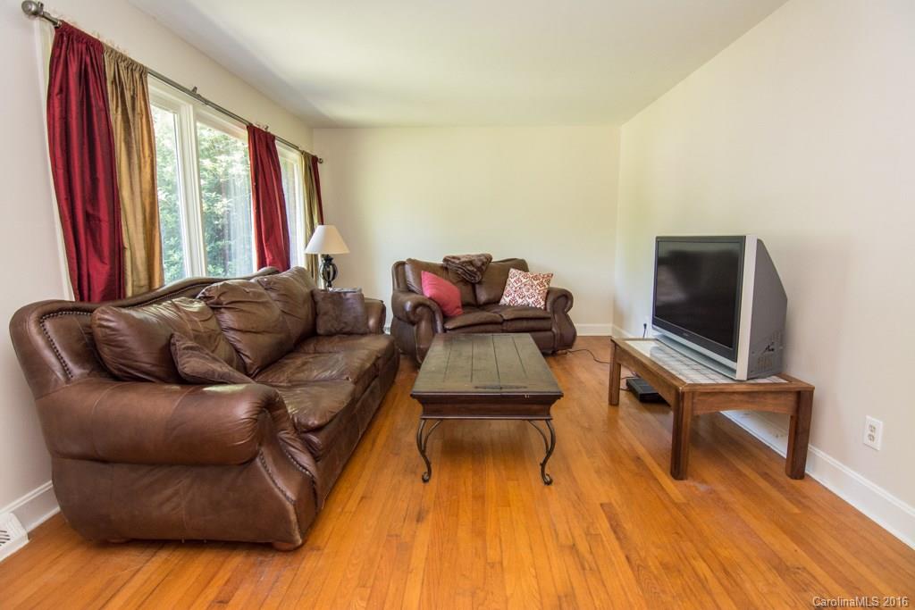7424 Watercrest Road, Unit 14 Charlotte, NC 28210 - Photo 4 of 21 a living room with furniture and a flat screen tv