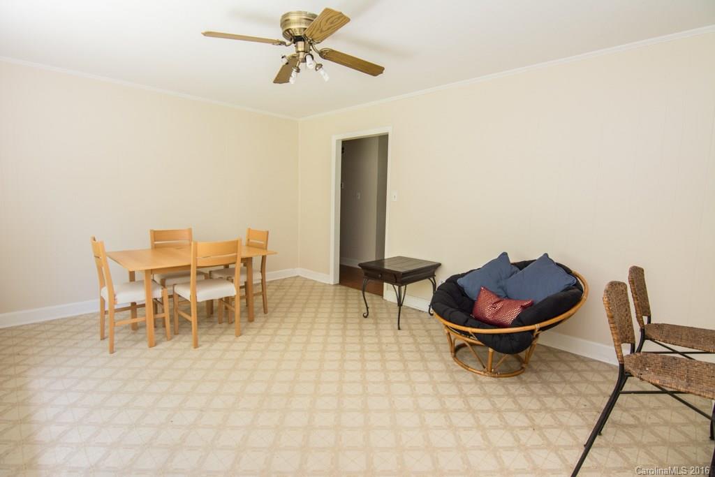 7424 Watercrest Road, Unit 14 Charlotte, NC 28210 - Photo 6 of 21 a view of a dining room with furniture and a potted plant