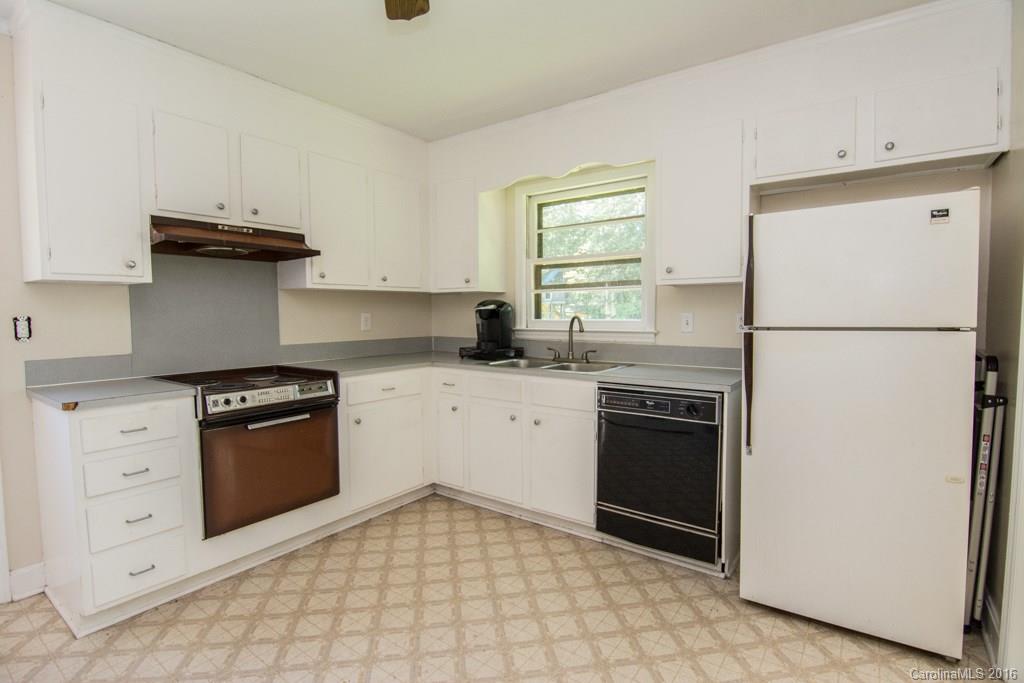 7424 Watercrest Road, Unit 14 Charlotte, NC 28210 - Photo 8 of 21 a kitchen with cabinets stainless steel appliances and a counter space