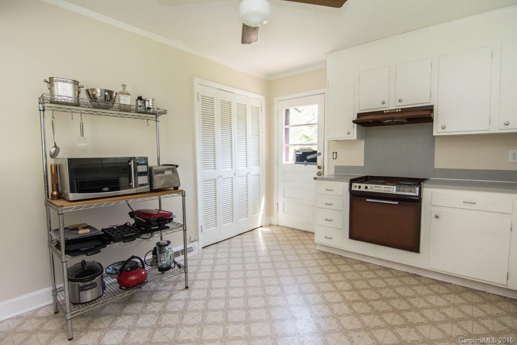 7424 Watercrest Road, Unit 14 Charlotte, NC 28210 - Photo 9 of 21 a kitchen with granite countertop a stove and a sink