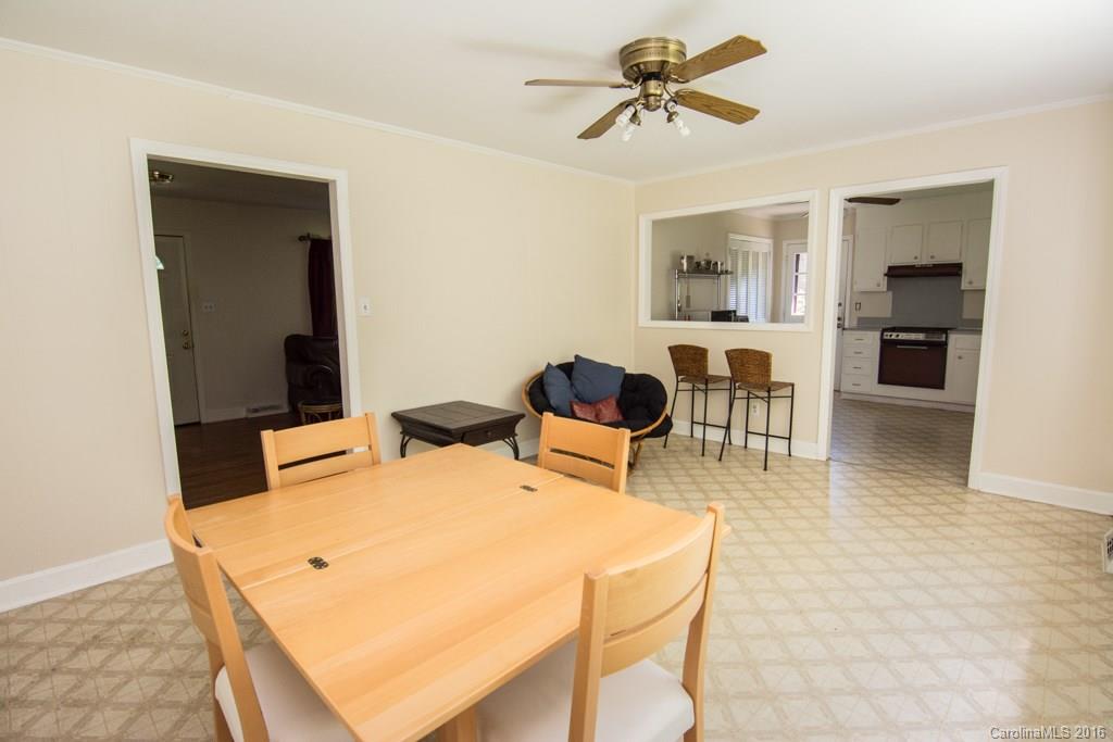 7424 Watercrest Road, Unit 14 Charlotte, NC 28210 - Photo 10 of 21 a living room with furniture a rug and white walls