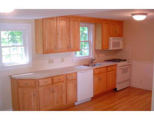 40 Clifton Road Milton, MA 02186 - Photo 6 of 9 a kitchen with granite countertop a sink cabinets and a wooden floor