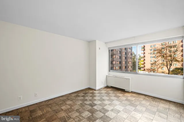 a view of an empty room with a window