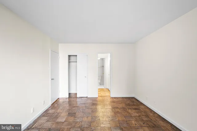 a bathroom with a granite countertop sink a mirror and shower