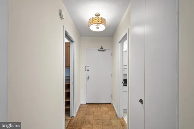 a living room with furniture a flat screen tv and a window