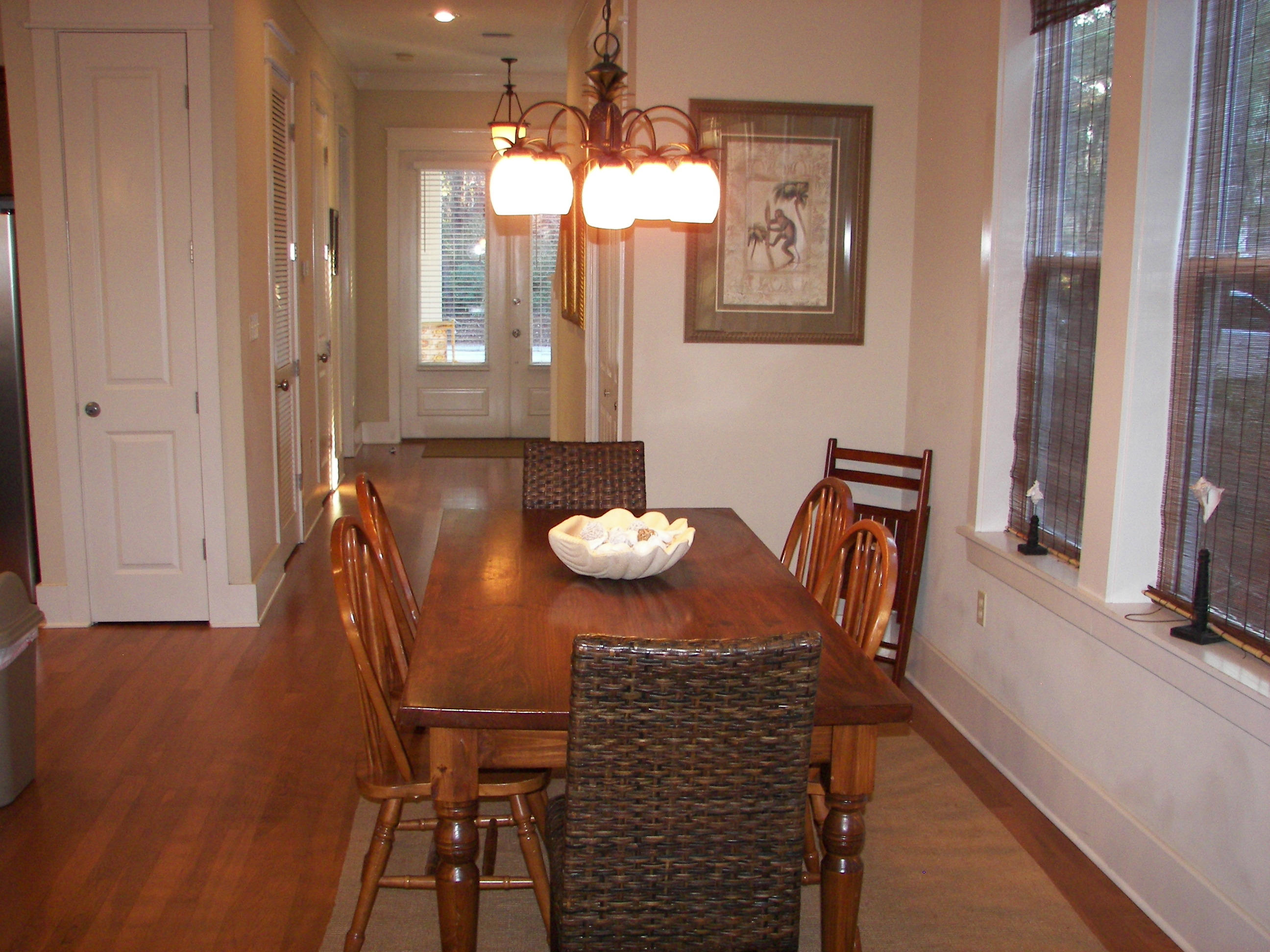 69 Lifeguard Loop West Inlet Beach, FL 32461 - Photo 12 of 34 a view of a dining room with furniture and wooden floor
