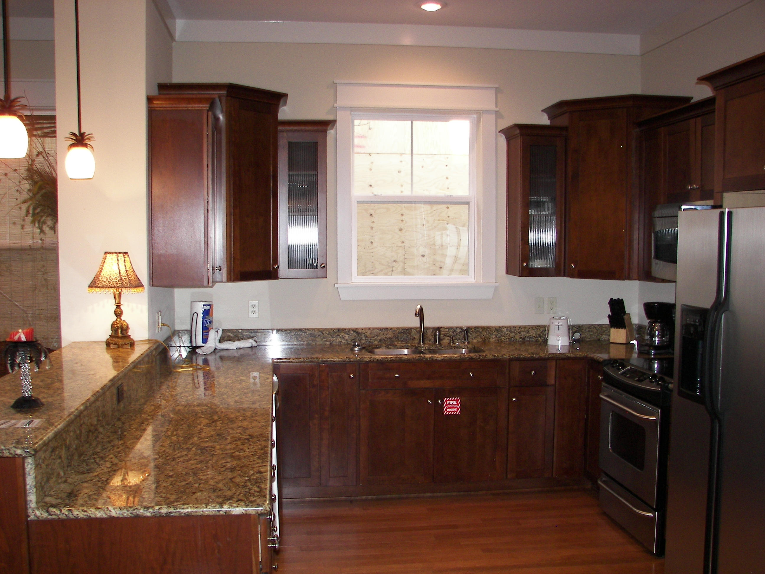 69 Lifeguard Loop West Inlet Beach, FL 32461 - Photo 14 of 34 a kitchen with granite countertop stainless steel appliances stove microwave refrigerator and sink