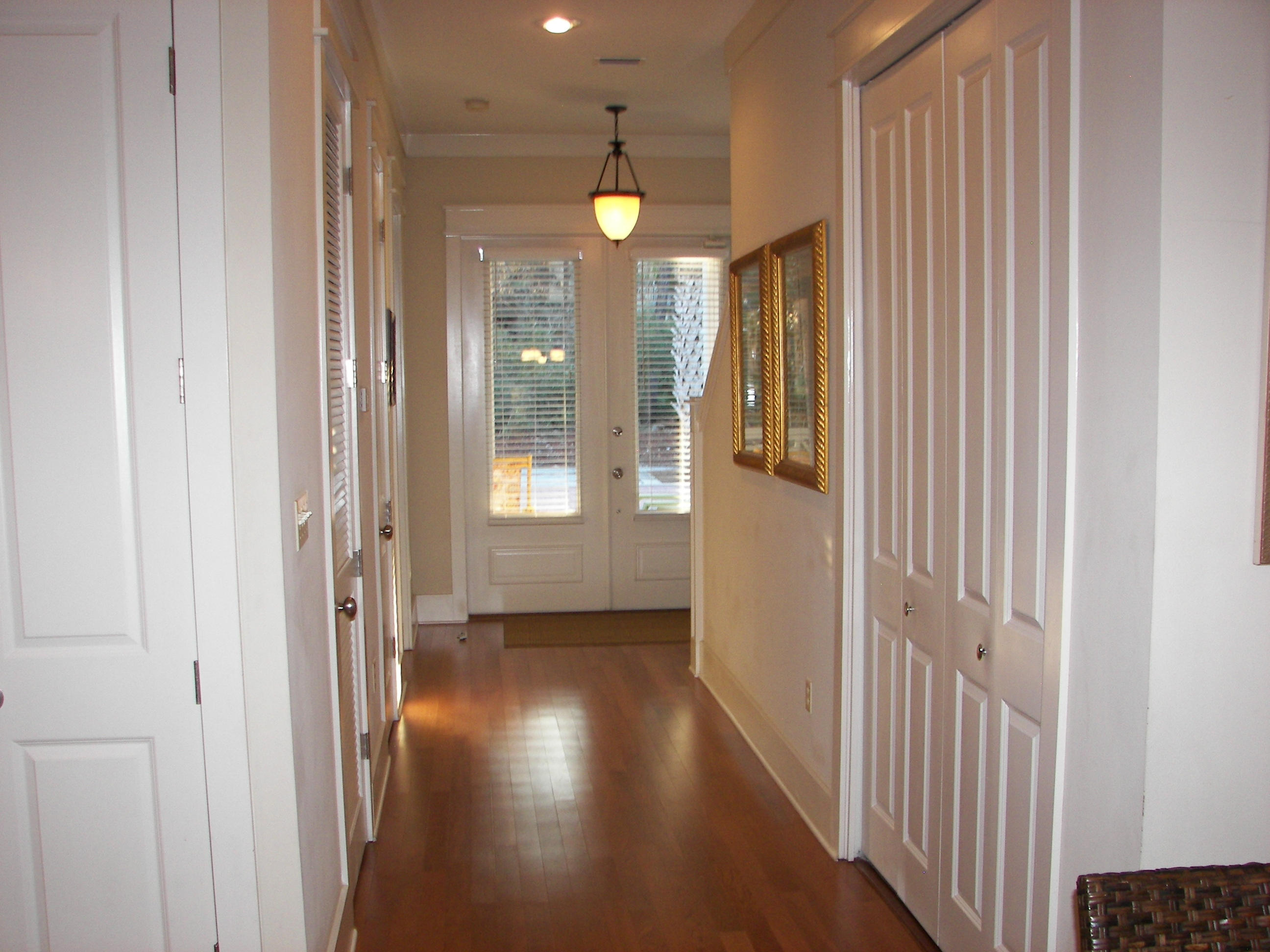 69 Lifeguard Loop West Inlet Beach, FL 32461 - Photo 15 of 34 a view of a hallway with wooden floor and a bathroom